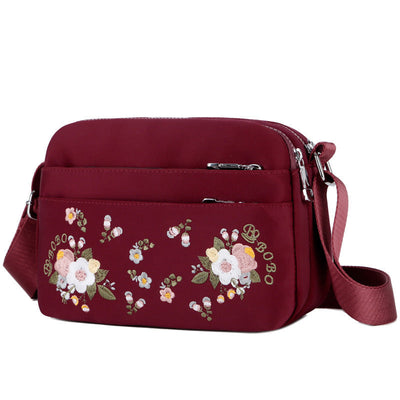 Sac à bandoulière imperméable avec fleur brodée