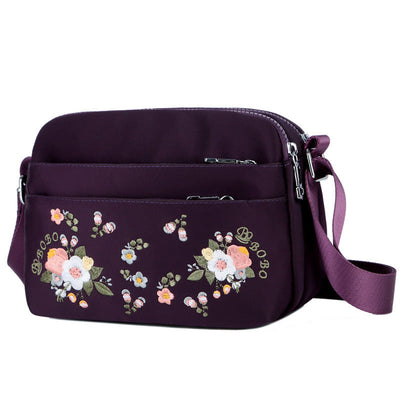 Sac à bandoulière imperméable avec fleur brodée