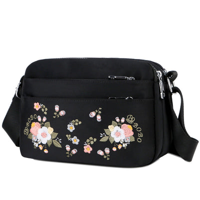 Sac à bandoulière imperméable avec fleur brodée